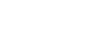 Ein Bild von drei Spielkarten auf einem grünen Filztisch in einem Casino. Die Karten zeigen ein Herz, einen Pik und ein Karo Symbol.